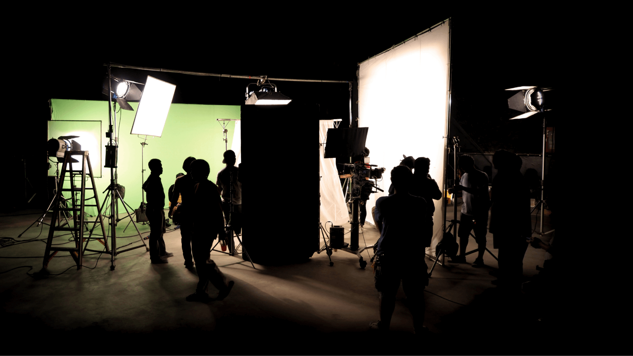 An video production companies near you with a crew filming on set and a green screen in the background.