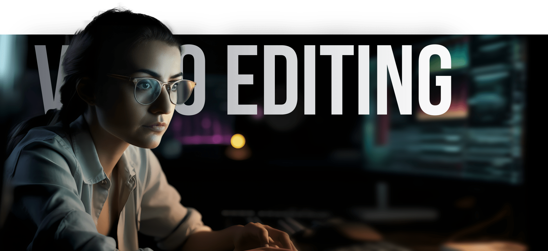 A Person Wearing Glasses And A Button-Up Shirt Sits At A Computer In A Dimly Lit Room. The Screen Displays Video Editing Software. Large Text In The Background Reads &Quot;Video Editing. A person wearing glasses and a button-up shirt sits at a computer in a dimly lit room. The screen displays video editing software. Large text in the background reads "VIDEO EDITING.