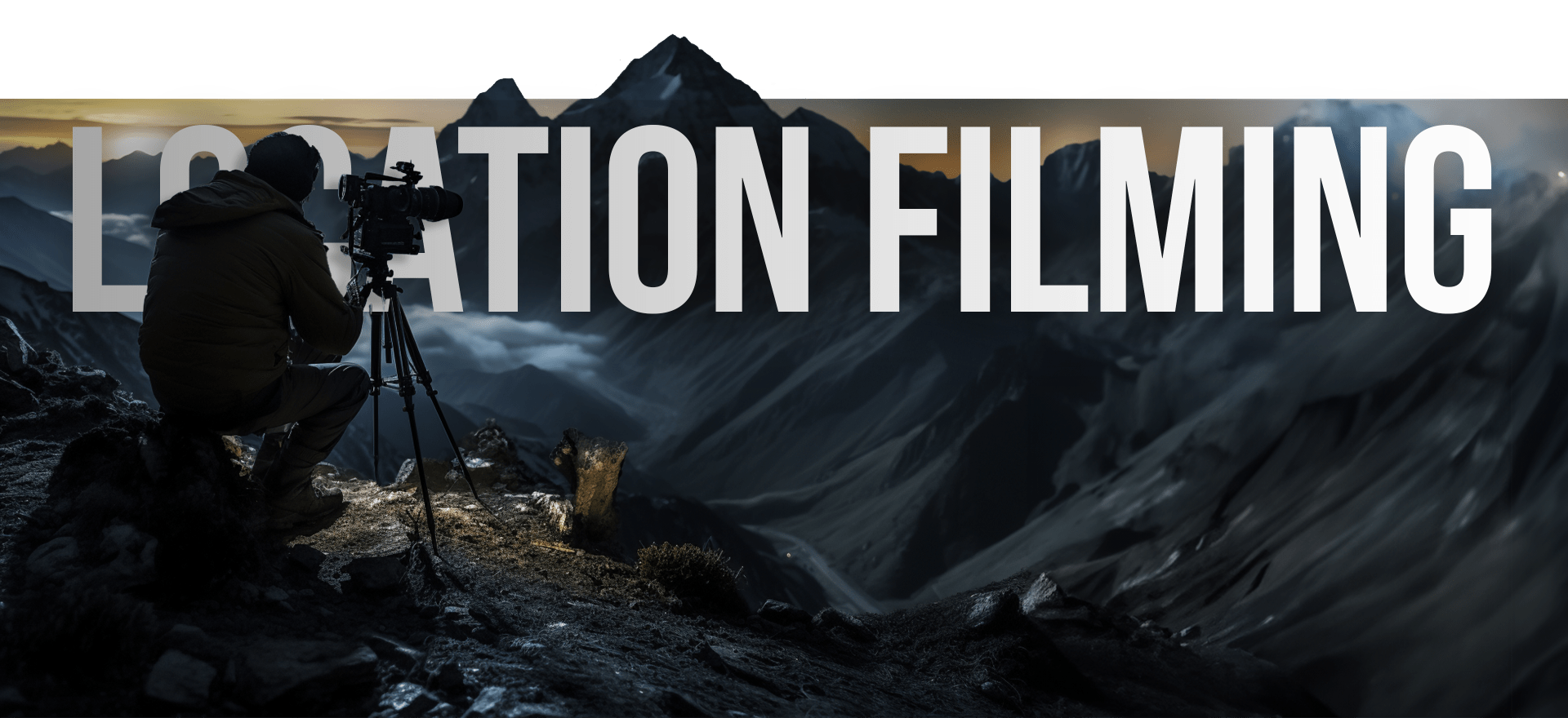 A person in winter clothing operates a camera on a tripod on a rugged, dark mountain landscape. The words "Location Filming" are prominently shown in the background, partially obscured by the mountainous scenery.