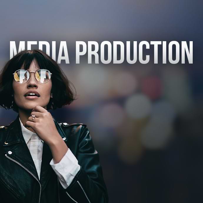 Media Production services at Dragonfly. A woman in a leather jacket and rounded glasses in thought.