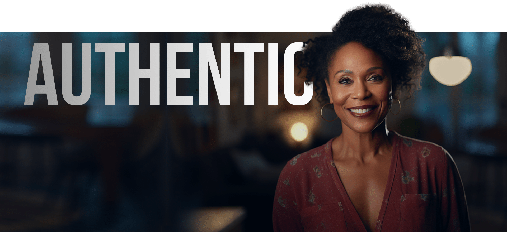 A Woman With Curly Hair And Hoop Earrings Smiles Warmly. She Is Wearing A Red Blouse With A Subtle Pattern. The Background Is Softly Blurred, Featuring Warm Lighting, And The Word &Quot;Authentic&Quot; Is Boldly Displayed Beside Her In Large, White Letters. A woman with curly hair and hoop earrings smiles warmly. She is wearing a red blouse with a subtle pattern. The background is softly blurred, featuring warm lighting, and the word "AUTHENTIC" is boldly displayed beside her in large, white letters.