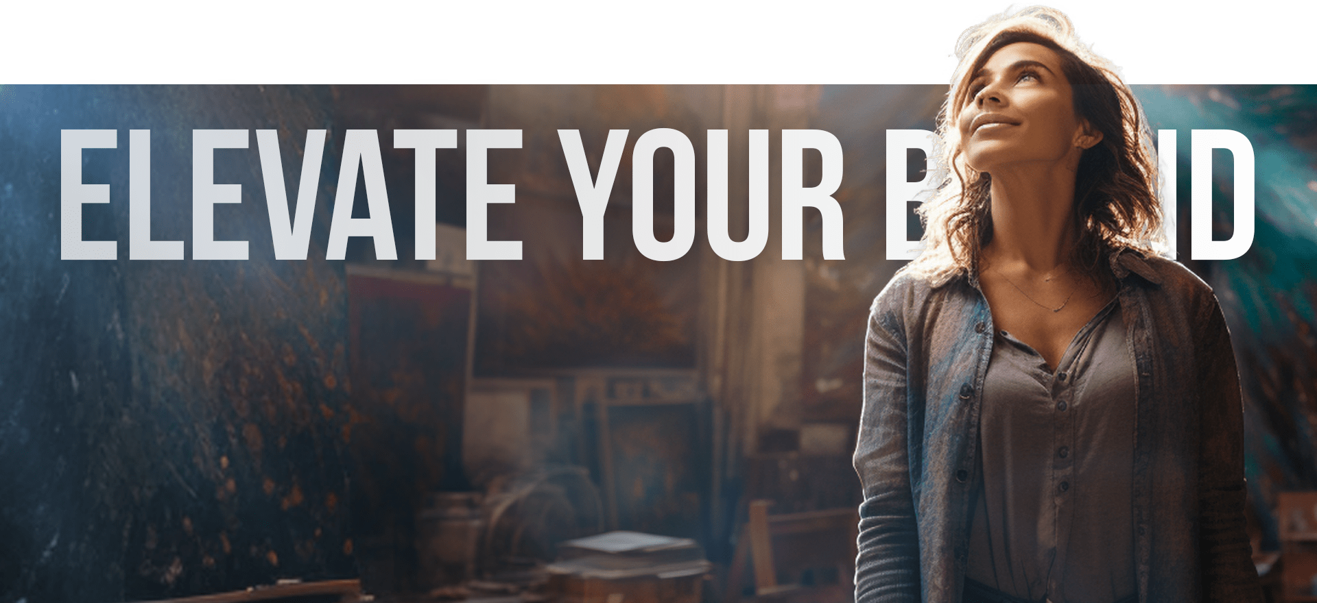 A Woman With Wavy Hair And A Confident Expression Looks Up While Standing In A Rustic, Well-Lit Room. Behind Her, The Text &Quot;Elevate Your Brand&Quot; Is Prominently Displayed In Large White Letters. The Background Appears To Be An Artistic, Creative Workspace. A woman with wavy hair and a confident expression looks up while standing in a rustic, well-lit room. Behind her, the text "ELEVATE YOUR BRAND" is prominently displayed in large white letters. The background appears to be an artistic, creative workspace.