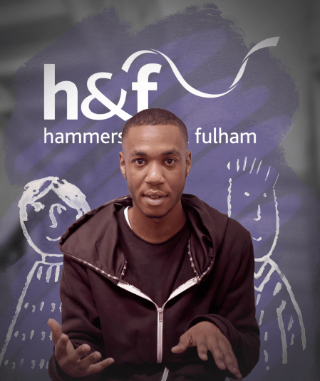 A man in a black hoodie speaks in front of a backdrop with "h&f hammersmith & fulham" written on it. The background features a hand-drawn illustration of two people in white.